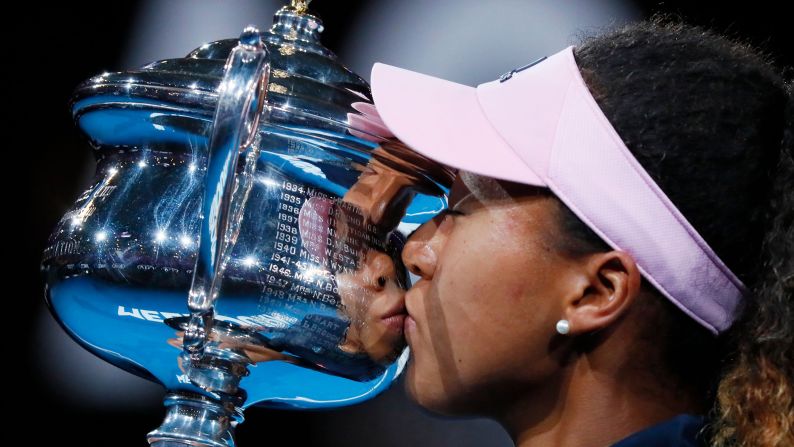 Naomi Osaka kisses her trophy after <a href="index.php?page=&url=https%3A%2F%2Fwww.cnn.com%2F2019%2F01%2F26%2Ftennis%2Fosaka-kvitova-australian-open-tennis-intl-spt%2Findex.html" target="_blank">winning the Australian Open</a> on Saturday, January 26. Osaka defeated Petra Kvitova in the final, winning 7-6 (7-2), 5-7, 6-4. It is the second straight Grand Slam title for Osaka, who also won the US Open last year. She will now become the first Japanese player to become No. 1 in the world.