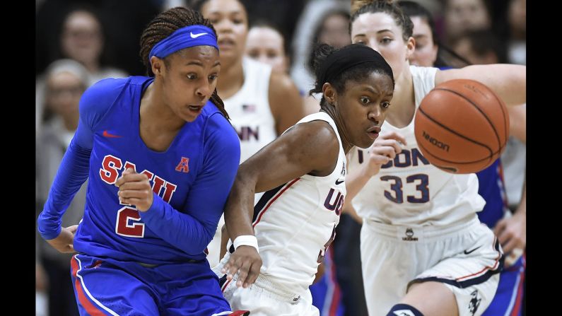 UConn's Crystal Dangerfield, right, steals the ball from SMU's Ariana Whitfield during a college basketball game in Storrs, Connecticut, on Wednesday, January 23.