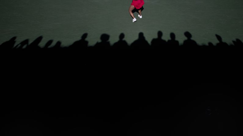 People watch Lauren Davis, a tennis player in the WTA Challenger Series, return a shot during a match in Newport Beach, California, on Friday, January 25.