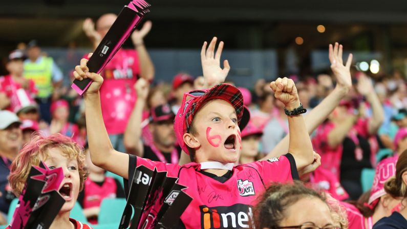 A young fan of the Sydney Sixers cheers on his cricket team during a match on Wednesday, January 23.