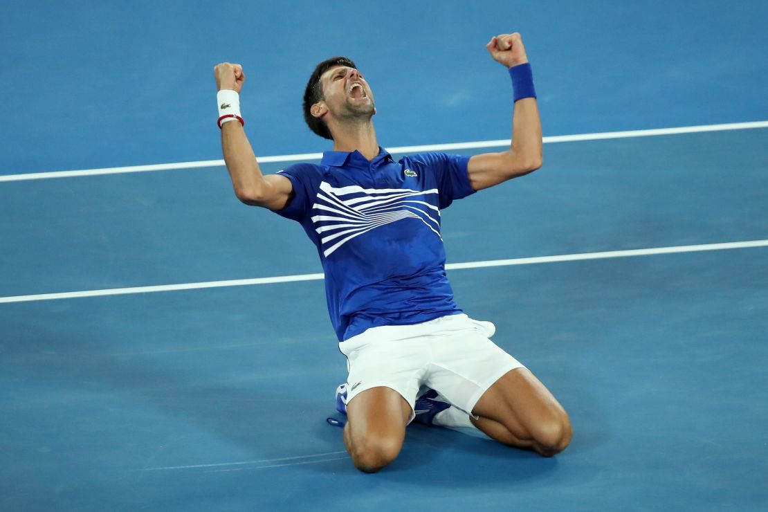 Novak Djokovic sinks to the court after beating Rafael Nadal at the Australian Open. 