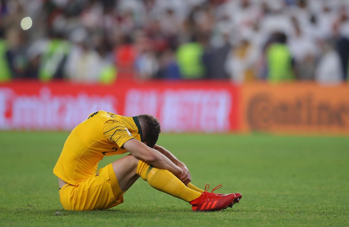 Milos Degenek of Australia looks dejected following the match.