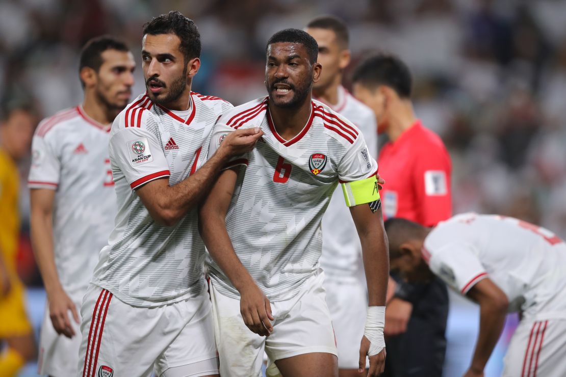 Fares Juma Al Saadi of United Arab Emirates interacts with teammates during the AFC Asian Cup quarter final.