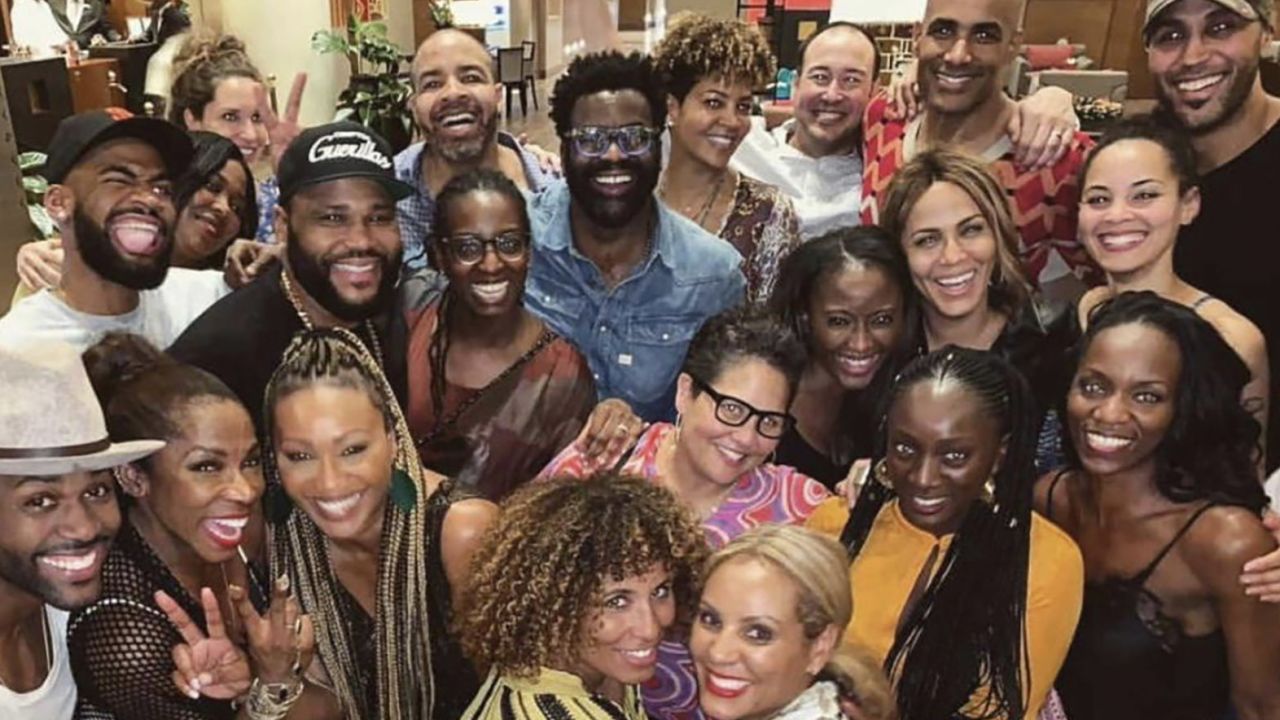 Attendees at the Full Circle Festival pose for a group photograph.