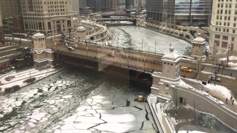 The Chicago River is partially frozen.