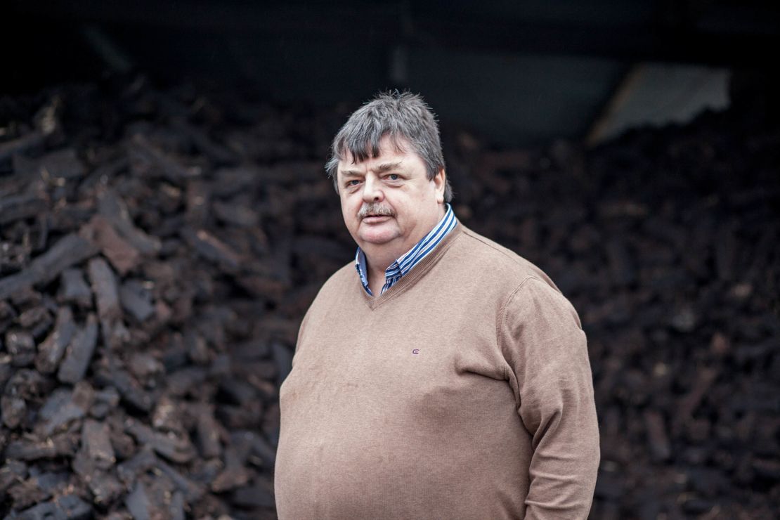 Martin Finnerty stands inside his turf shed at home. 
