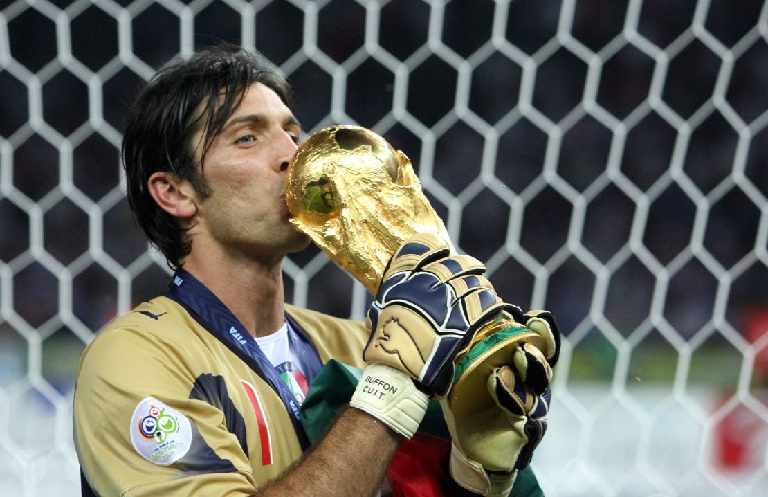 Italian goalkeeper Gianluigi Buffon kisses the trophy after the World Cup 2006 final.
