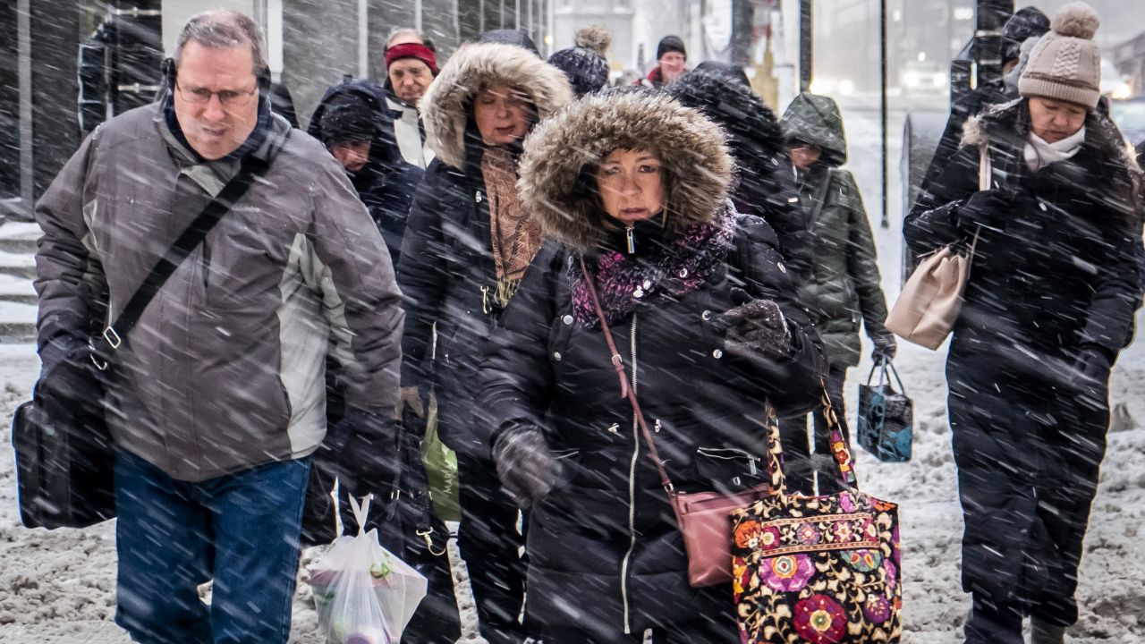 Morning commuters battle the weather in Chicago on January 28.