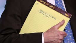 WASHINGTON, DC - JANUARY 28: With handwritten notes on a legal pad, National Security Advisor John Bolton listens to questions from reporters during a press briefing at the White House January 28, 2019 in Washington, DC. During the briefing, economic sanctions against Venezuela's state owned oil company were announced in an effort to force Venezuelan President Maduro to step down.  (Photo by Win McNamee/Getty Images)