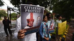 NEW DELHI, INDIA - SEPTEMBER 21: People hold a protest against Bishop Franco Mulakkal for his arrest outside the Kerala House, on September 21, 2018 in New Delhi, India. Bishop Franco Mullakkal of Missionaries of Jesus, who served as priest of Roman Catholic Diocese of Jalandhar up until 15th of September 2018, was accused by a nun of raping her. The bishop had, however, dismissed the allegations as baseless and concocted, insisting she levelled those as the catholic order had rejected her demand for favours. (Photo by Biplov Bhuyan/Hindustan Times via Getty Images)