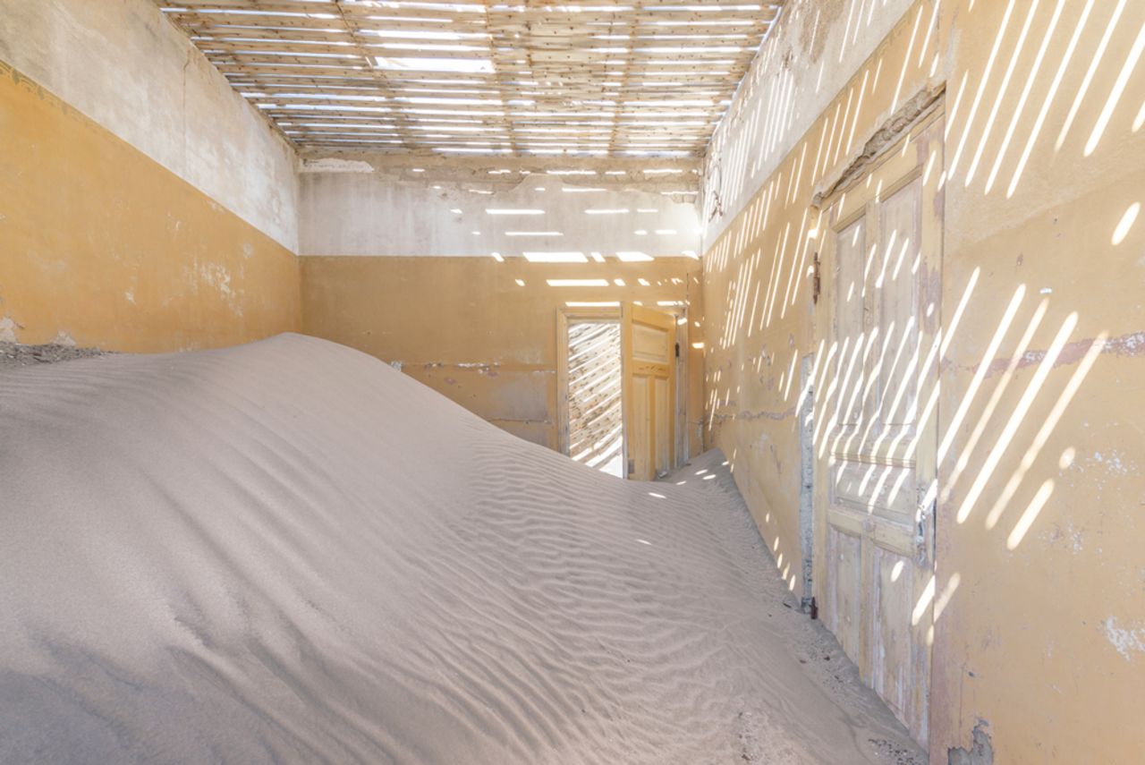 In Kolmanskop, the desert sands have partially reclaimed the buildings.