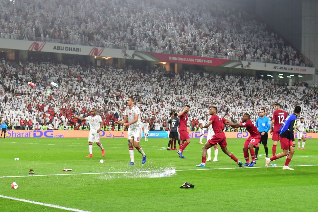 Fans throw bottles and flip-flops at the pitch during the semifinal. 