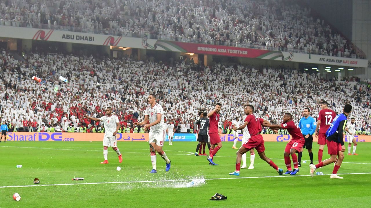 Fans throw bottles and flip-flops at the pitch during the semifinal. 