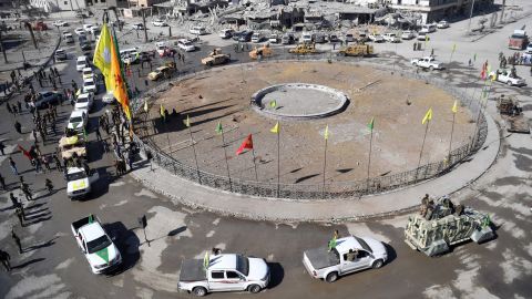 Female fighters of the Syrian Democratic Forces (SDF) gather during a celebration at the Al-Naim square in Raqqa on October 19, 2017, after retaking the city from ISIS.