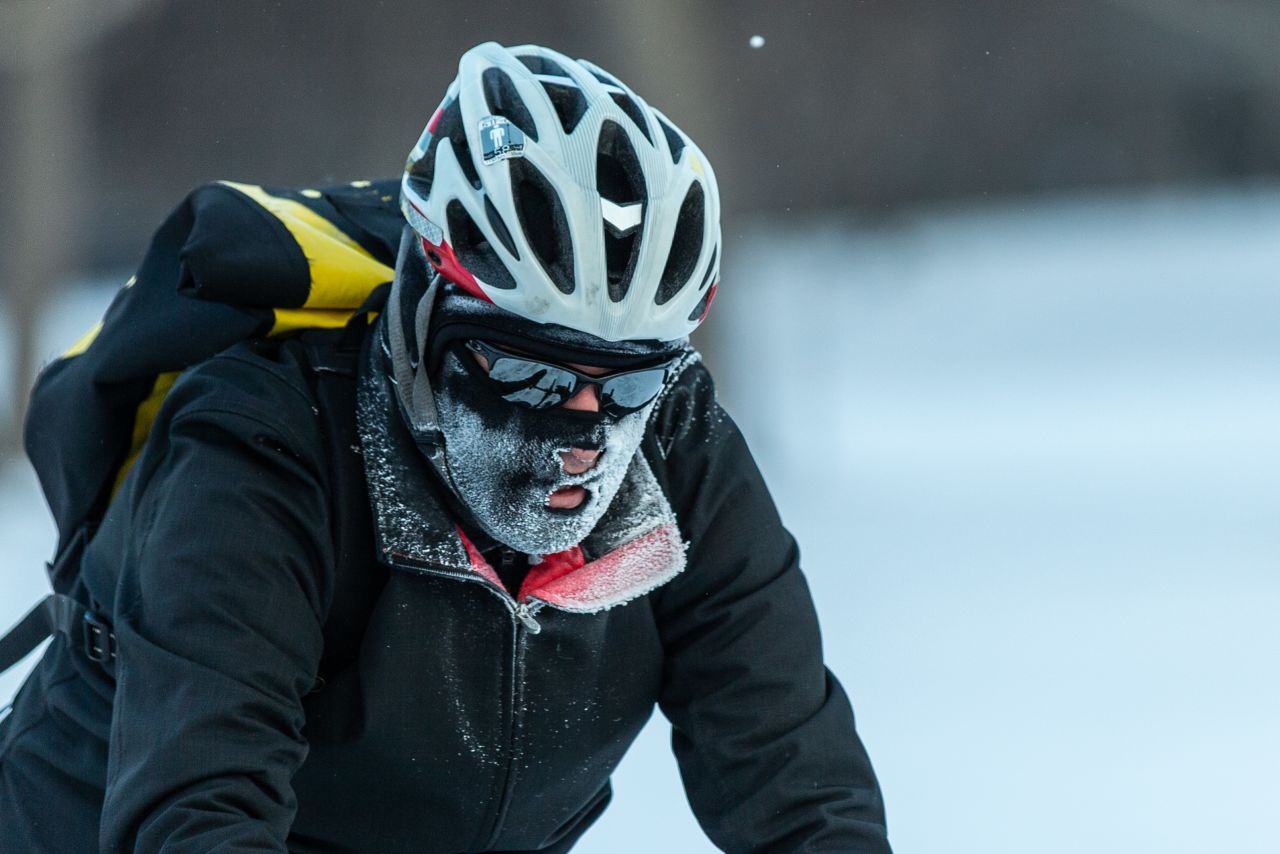 A cyclist braves the heavy frost in Minneapolis.