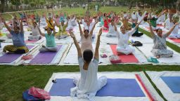 Indian yoga practitioners take part in a yoga session ahead of International Yoga Day at a park in Amritsar on June 20, 2018. - Yoga, which means union in Sanskrit, is a family of ancient spiritual practices and also a school of spiritual thought from South Asia, where it remains a vibrant living tradition and is seen as a means of enlightenment. (Photo by NARINDER NANU / AFP)        (Photo credit should read NARINDER NANU/AFP/Getty Images)