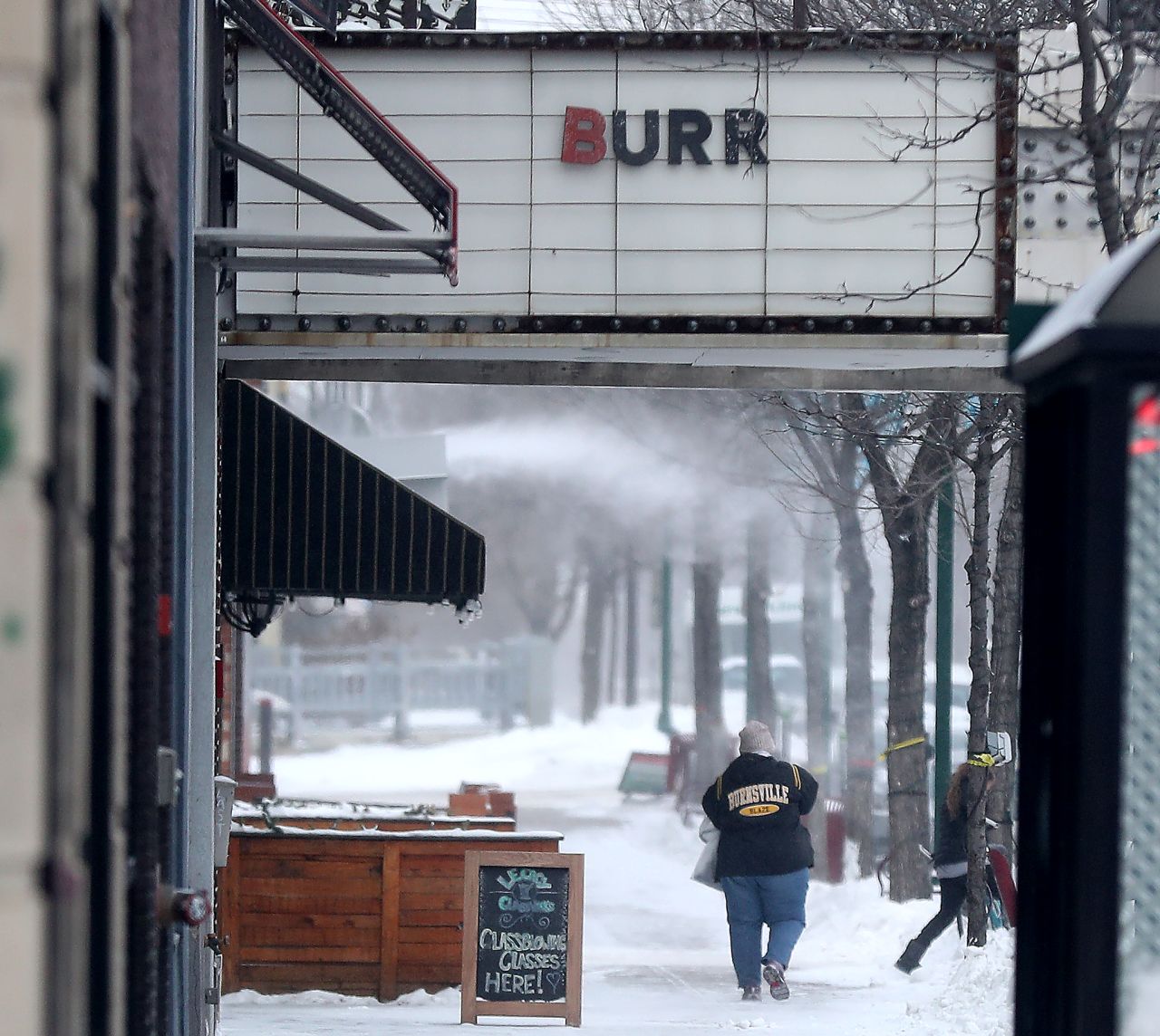 The inscription on a business marquee reads "BURR" in Minneapolis.