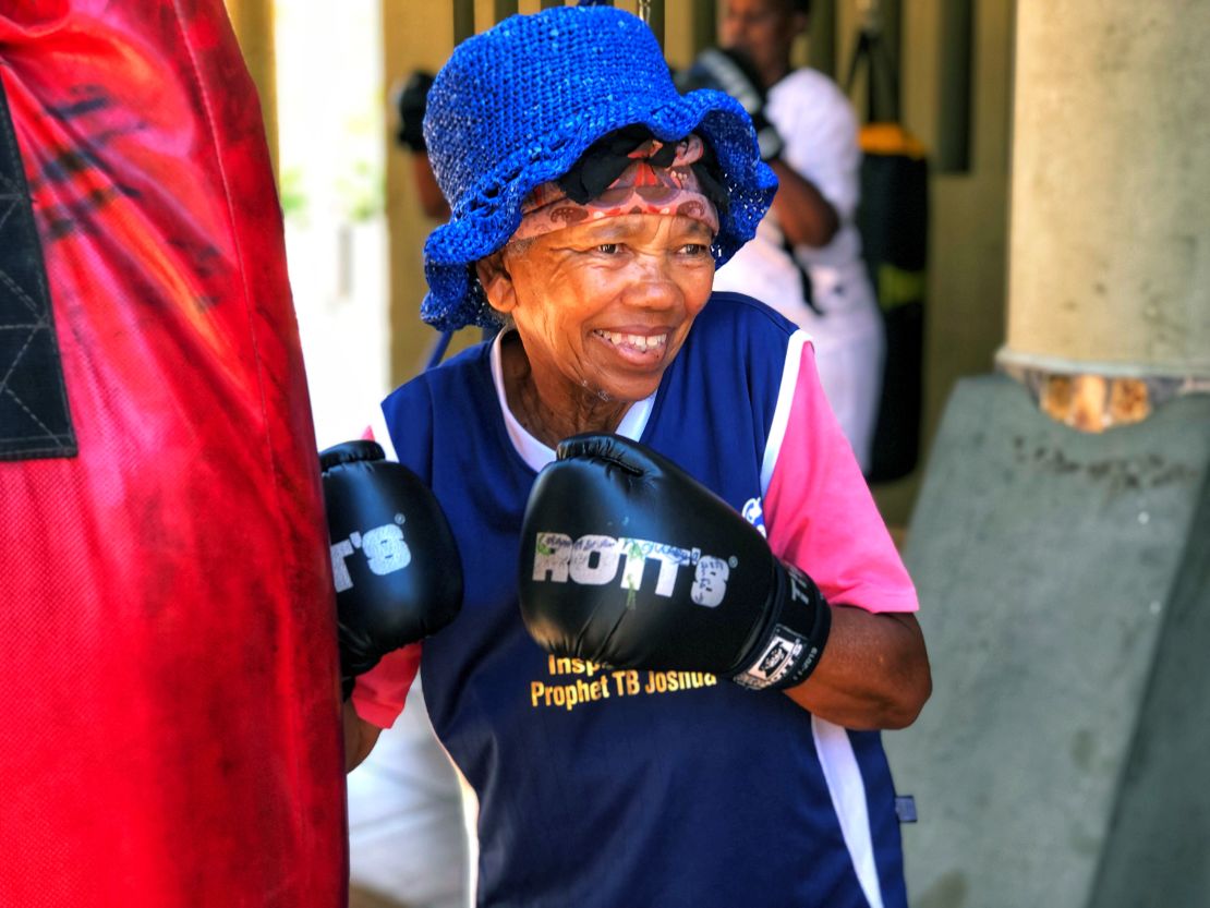 Gladys Ngwenya, 78, smiles during a boxing session at a gym in Cosmo City, South Africa.
