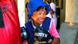 Gladys Ngwenya, 78, smiles during a boxing session at a gym in Cosmo City, South Africa.