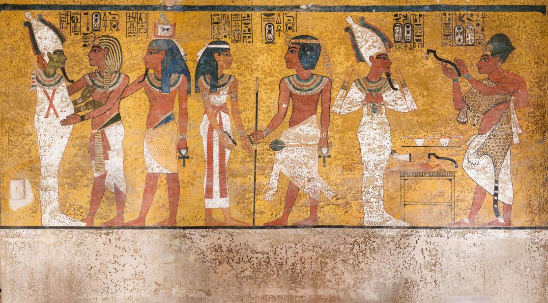 This wall painting depicts three separate scenes. On the right, Ay, Tutankhamun's successor, performs the "opening of the mouth" ceremony on Tutankhamun, who is depicted as Osiris, lord of the underworld. In the middle scene, Tutankhamun, dressed in the costume of the living king, is welcomed into the realm of the gods by the goddess Nut. On the left, Tutankhamun, followed by his ka (spirit twin), is embraced by Osiris. 