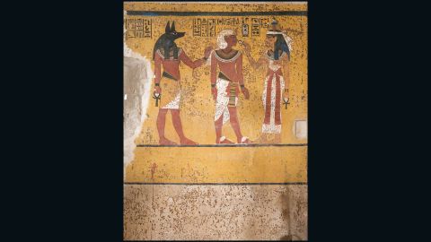A section of the south wall in the burial chamber of Tutankhamun. Mirroring the theme of the north wall, the painting here shows Tutankhamun with various deities. He stands before Hathor, goddess of the West, while behind the king stands Anubis, the embalmer god. Behind him originally stood the goddess Isis with three other minor deities (the plaster supporting these ﬁgures was removed when Carter dismantled the partition wall during the tomb's clearance.