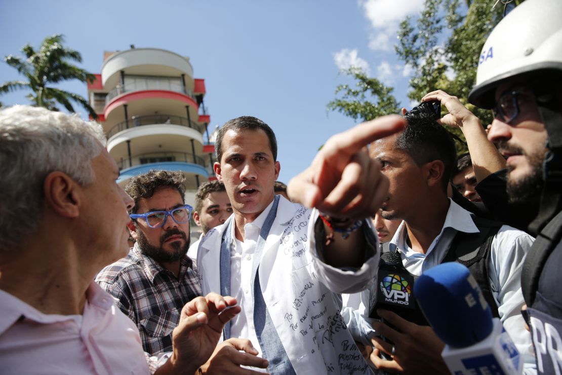 Opposition National Assembly President Juan Guaido speaks to reporters in Caracas, Venezuela, Wednesday, Jan. 30, 2019. 