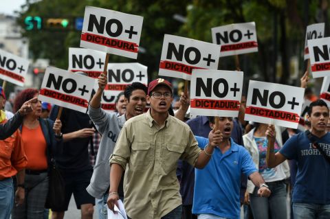 Opposition demonstrators protest against Maduro's government on Wednesday, January 30.