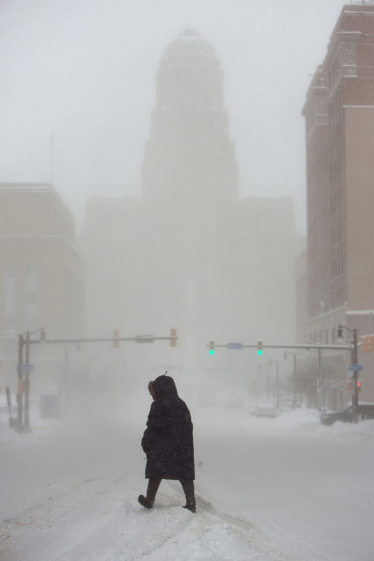 A woman crosses a street in Buffalo, New York, on January 30.