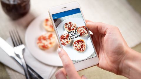 The new promotion lets customers earn a free Domino's pie when they eat pizza — even if they buy it from a competitor.  