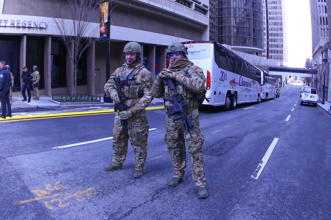 Department of Homeland Security agents guard the streets near the hotel hosting the New England Patriots.