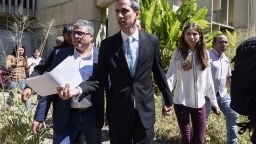 Opposition leader and self-proclaimed "acting president" Juan Guaido (C) accompained by his wife Fabiana Rosales (2-R) arrives at Venezuela's Central University (UCV) in Caracas to present his government's plan on January 31, 2019. - Venezuela's self-proclaimed acting president Juan Guaido ruled out the possibility of civil war in his country, saying the overwhelming majority of his compatriots wanted Nicolas Maduro to step down. In an interview to Spain's El Pais newspaper published Thursday, Guaido repeated an appeal to Venezuela's armed forces to take his side. (Photo by JUAN BARRETO / AFP)        (Photo credit should read JUAN BARRETO/AFP/Getty Images)