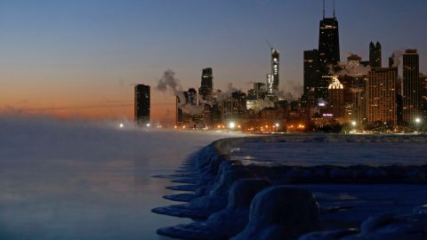Ice lines the shore of Lake Michigan before sunrise on Thursday in Chicago.