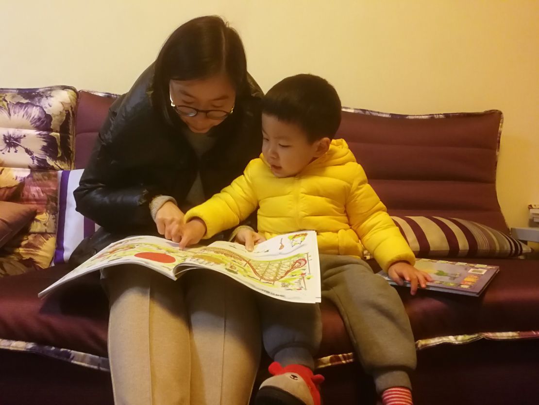 Chen Huijuan with her son Xiyan whose education and healthcare take up about a third of the household's salary.