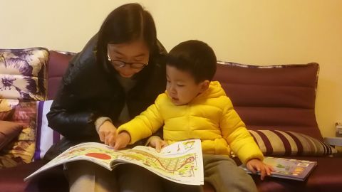 Chen Huijuan with her son Xiyan whose education and healthcare take up about a third of the household's salary.