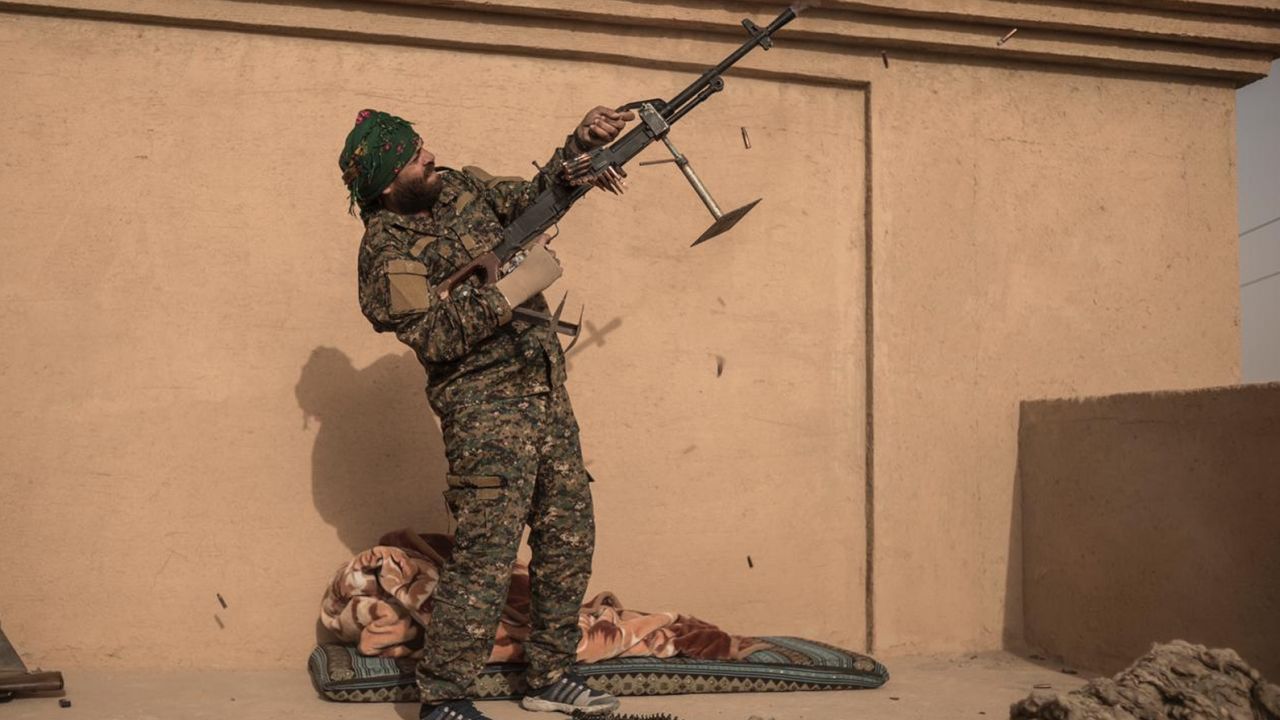 SDF Commander Haval Simco shoots at an ISIS drone in A-Shafa on January 10.