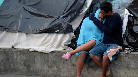 Venezuelan migrants remain at an improvised camp near a bus terminal in Bogota on November 13, 2018. 