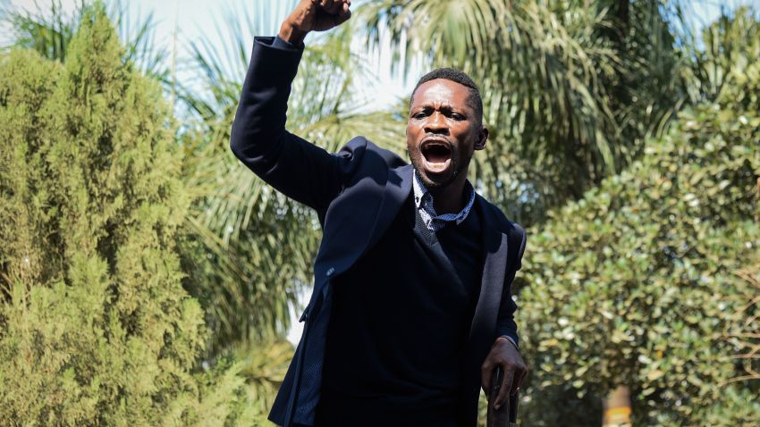 Ugandan pop star turned opposition MP, Robert Kyagulanyi, delivers a speech outside his home in Kampala, Uganda, after returning from the United States on September 20, 2018. - Kyagulanyi, 36 and better known as singer Bobi Wine, had been seeking medical treatment in the US. (Photo by Isaac Kasamani / AFP)        (Photo credit should read ISAAC KASAMANI/AFP/Getty Images)