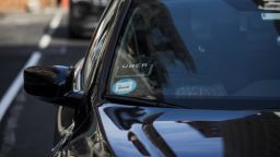 The Uber Technologies Inc. logo is seen on the windshield of a vehicle in New York.