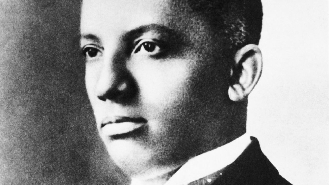 Carter G. Woodson, an African-American historian, wrote black Americans into US history