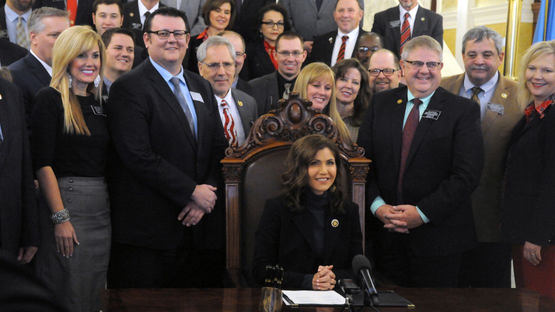 Gov. Kristi Noem signs her first bill into law on Thursday, allowing people to carry concealed pistols without a permit in South Dakota.