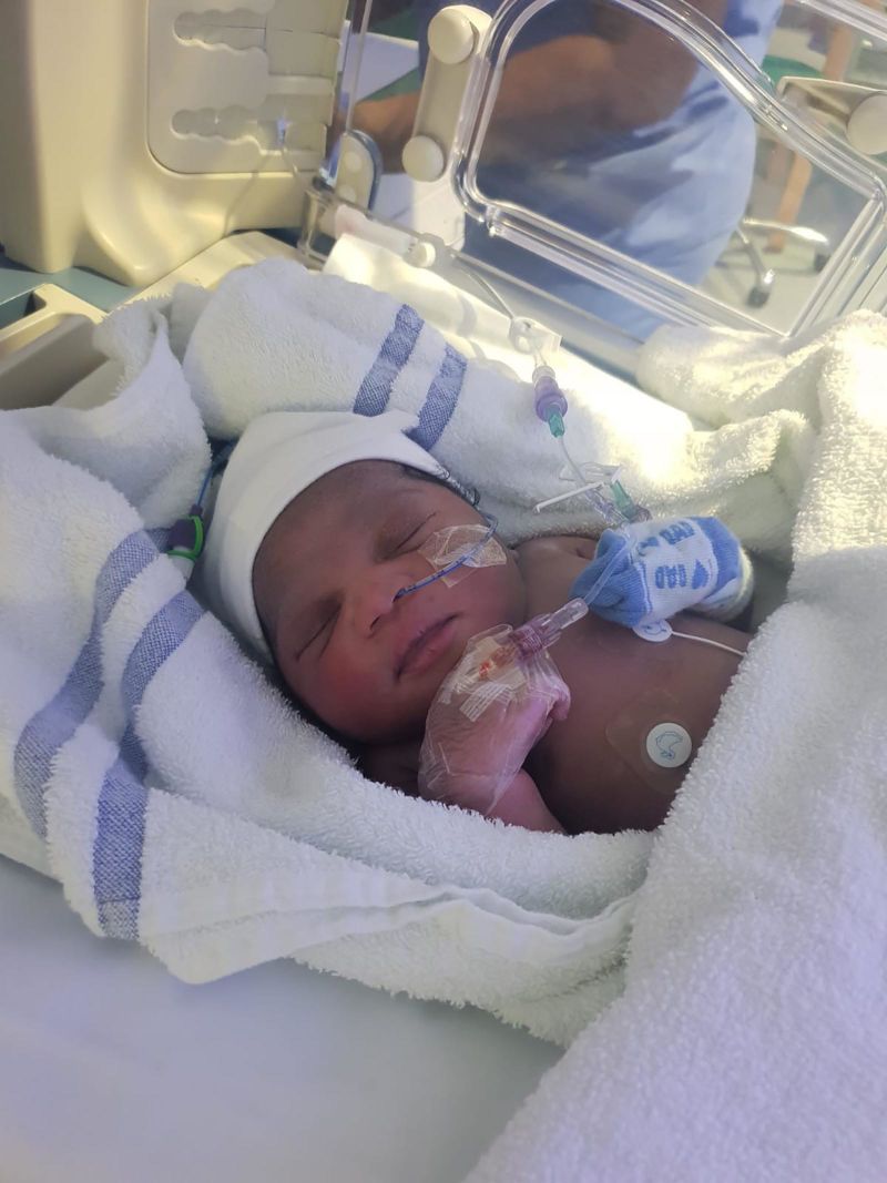 african american newborn baby girl in hospital