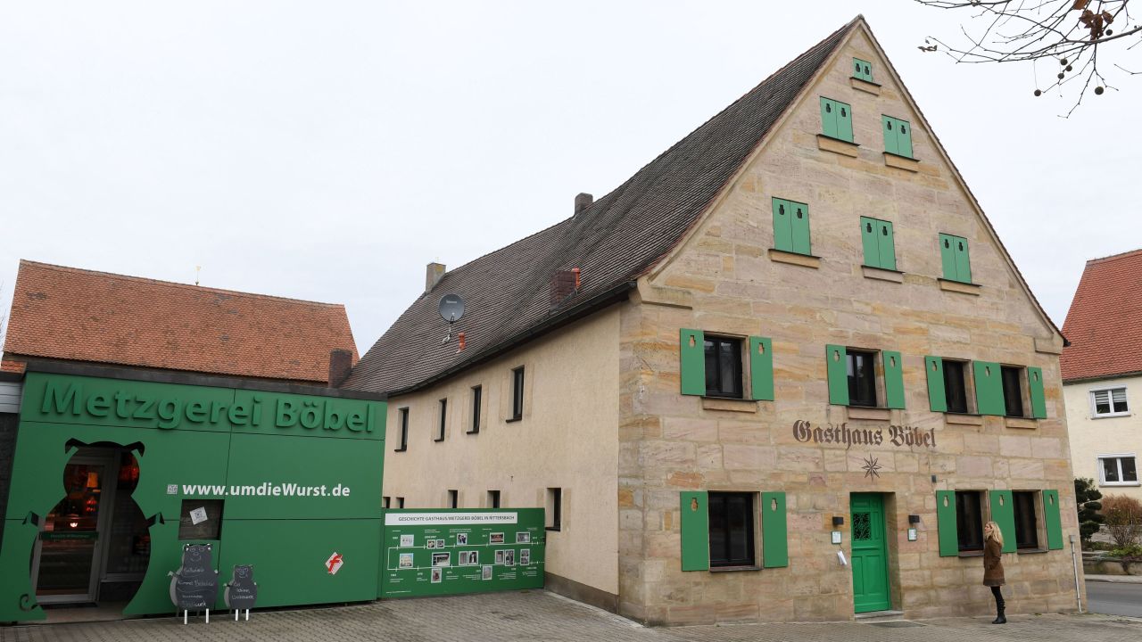 <strong>Forging connections:</strong> Boebel opened the hotel in this barn, pictured, next to his butchers, describing it as a "a place where people meet in Bavaria, in my home, and eat typical food and connect together."
