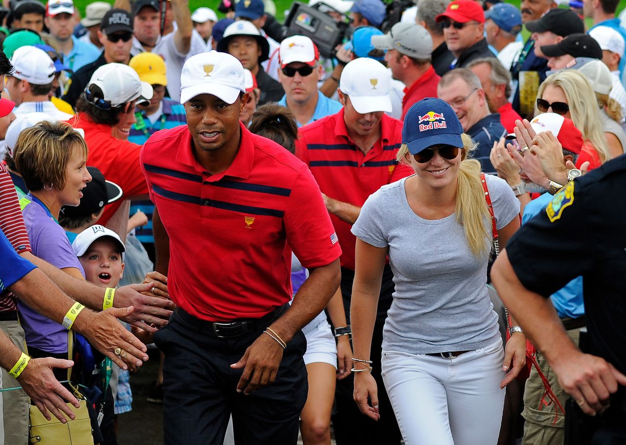 Woods and Vonn walk together at the Presidents Cup in October 2013.