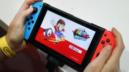 PARIS, FRANCE - OCTOBER 31:  A gamer plays the video game 'Super Mario Odyssey' developed and published by Nintendo on a Nintendo Switch games console during the 'Paris Games Week' on October 31, 2017 in Paris, France. 'Paris Games Week' is an international trade fair for video games to be held from October 31 to November 5, 2017.  (Photo by Chesnot/Getty Images)