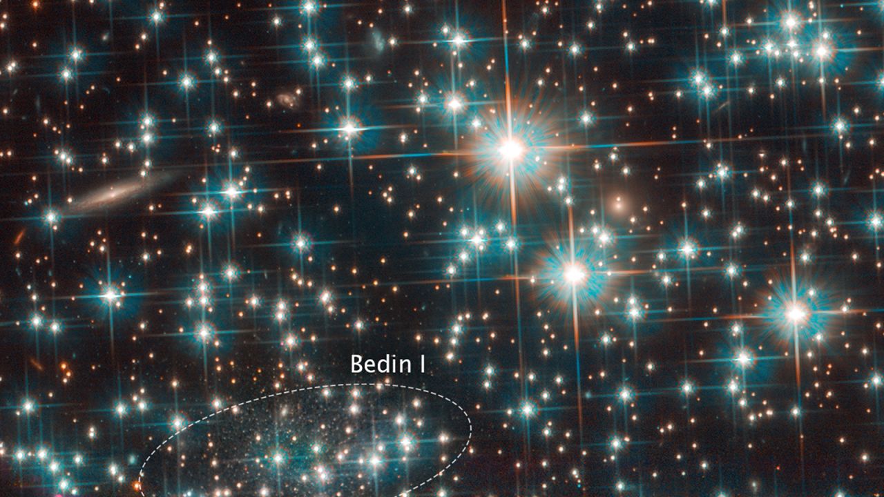 The Hubble Space Telescope found a dwarf galaxy hiding behind a big star cluster that's in our cosmic neighborhood. It's so old and pristine that researchers have dubbed it a "living fossil" from the early universe.