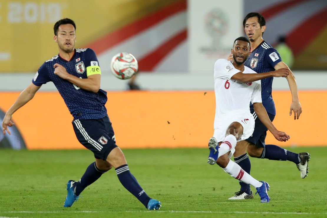 Abdelaziz Hatim of Qatar scores his team's second goal against Japan.