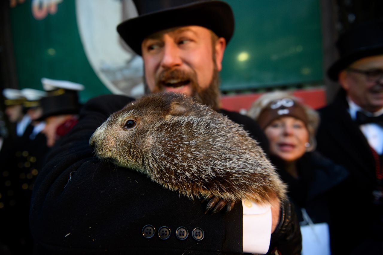 A.J. Dereume holds Punxsutawney Phil after he did not see his shadow Saturday on Groundhog Day.