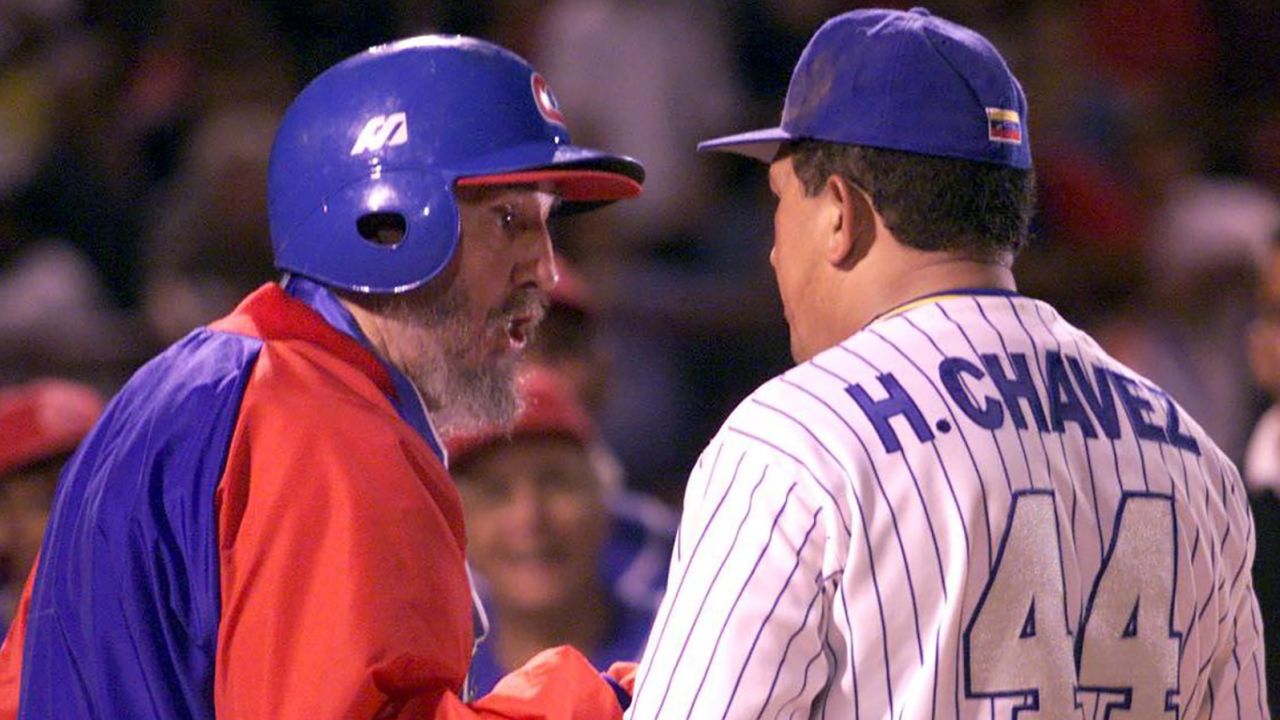 Castro talks with Chavez before a friendly baseball game between the Cuban and Venezuelan teams, in Venezuela in 2000.
