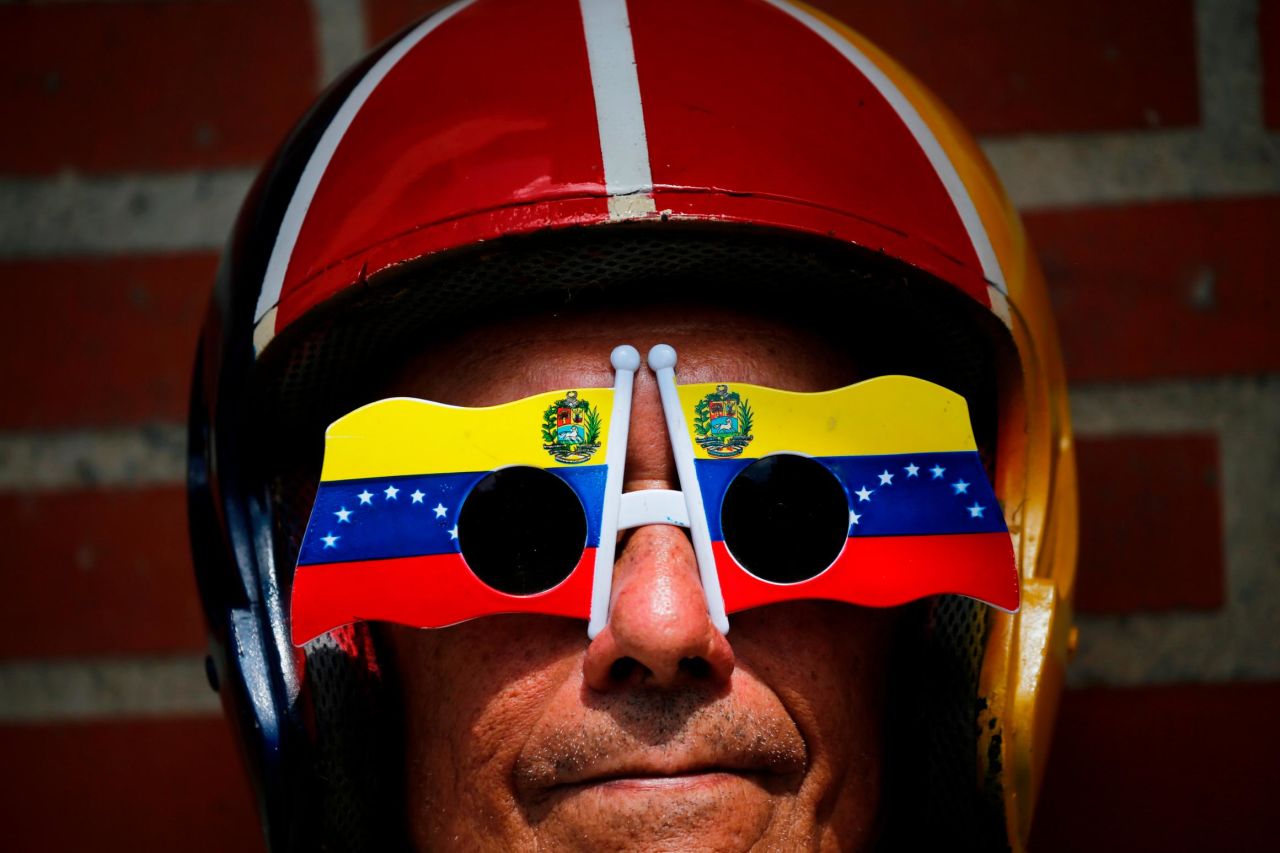 An anti-government protester wears glasses with a Venezuelan flag motif at the demonstration in Caracas on February 2.