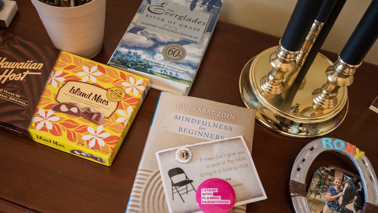 A book by Marjory Stoneman Douglas is among the items on a table in Mucarsel-Powell's congressional office.